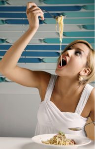 woman eating spaghetti